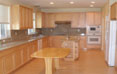 Maple kitchen cabinet with granite countertop.